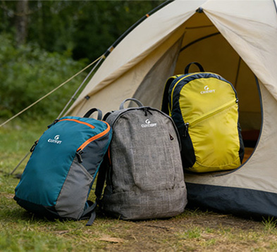 Storage bench with multiple backpacks neatly arranged in a mudroom area Storage bench with multiple backpacks neatly arranged in a mudroom area