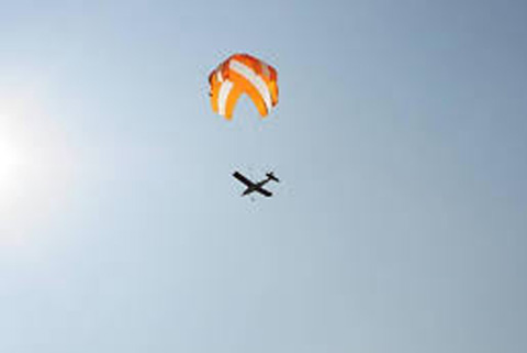 Technical diagram illustrating rapid deployment parachute systems for emergency use with labeled parts and performance data Technical diagram illustrating rapid deployment parachute systems for emergency use with labeled parts and performance data