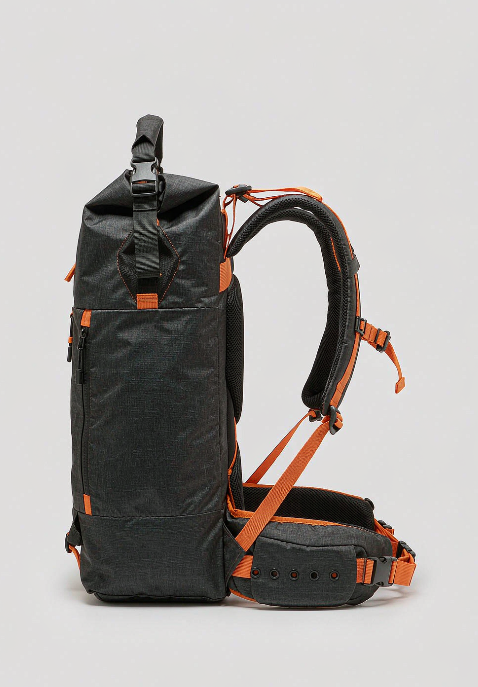 A versatile outdoor backpack in rugged water-resistant fabric with a roll-top closure, compression straps, padded shoulder straps and hip belt, shown on a clean white background.